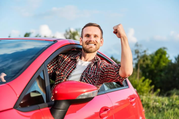 guy in red car